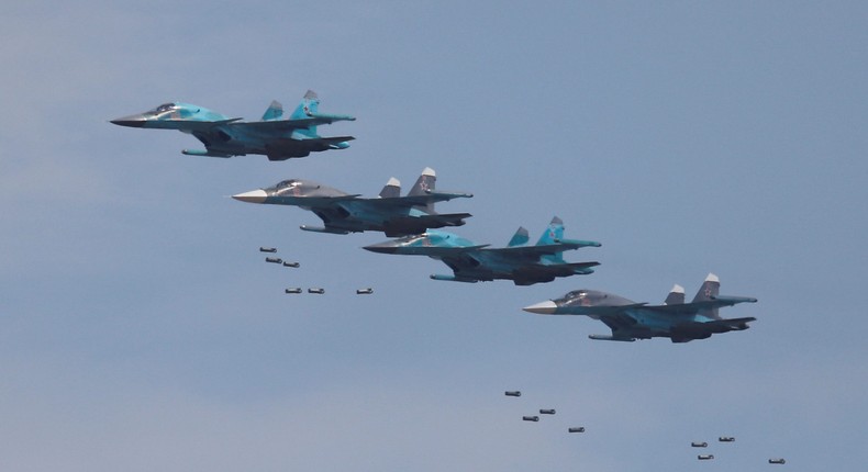 Sukhoi Su-34 bombers drop bombs during the Aviadarts competition, as part of the International Army Games 2018, at the Dubrovichi range outside Ryazan, Russia August 4, 2018.REUTERS/Maxim Shemetov