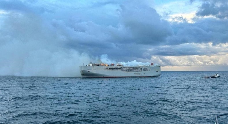 Smoke rises as a fire broke out on the cargo ship Fremantle Highway, at sea on July 26, 2023.Coastguard Netherlands/Reuters