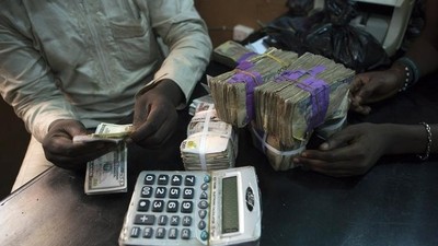 The open indicative rate closed at ₦‎703.50 to the dollar on Monday [Reuters/Joe Penney]