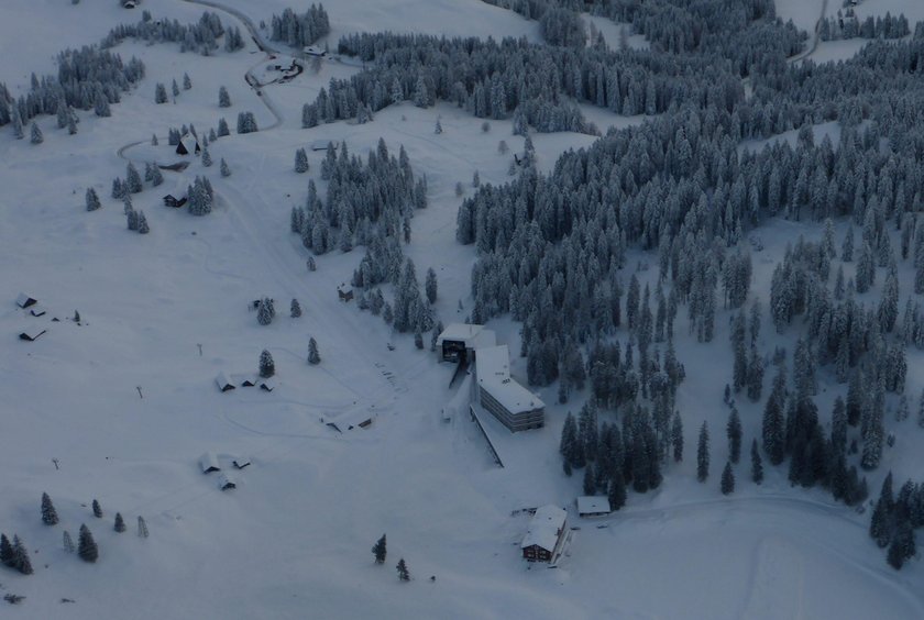 Workers shovel snow out of a restaurant after an avalanche at Santis-Schwaegalp mountain resort