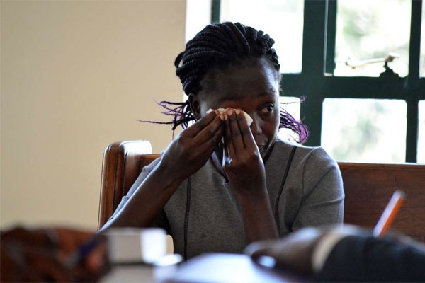 Ms Lencer Achieng', Baby Samatha Pendo's mother, testifies during an inquest