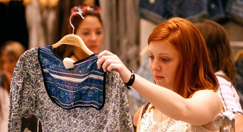 Customer shopping in Forever 21 - fast fashion, clothing, retail