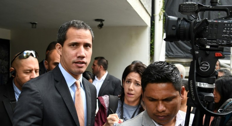 Lawmakers supporting Venezuelan opposition leader and self-proclaimed acting president Juan Guaido (C) say that pro-government loyalists opened fire at them