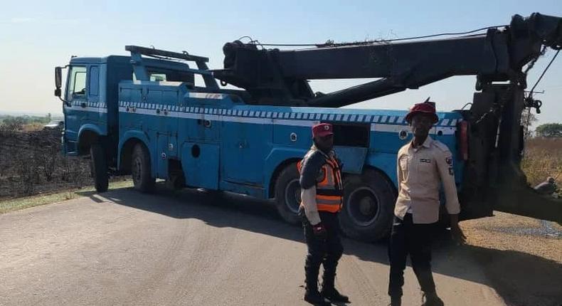 Personnel of FRSC at the scene of road traffic crash on Kano-Kaduna expressway on Sunday in Kaduna. [NAN]