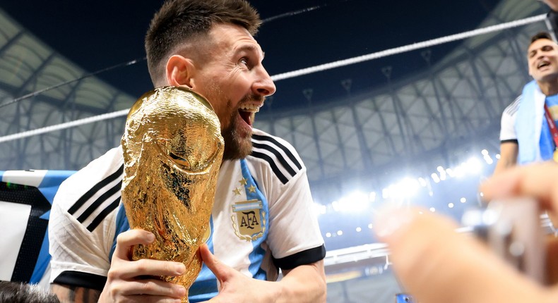 Lionel Messi of Argentina celebrates with the FIFA World Cup Qatar 2022 Winner's Trophy.Gustavo Pagano/Getty Images