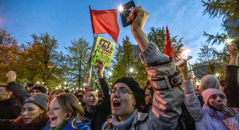 Activists protesting against a plan to build an Orthodox cathedral rally at a construction site in a park in the Russian Urals city of Yekaterinburg on May 15, 2019