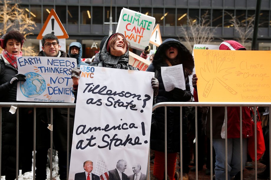 Demonstrators protest Trump's Cabinet picks outside the office of Sen. Charles Schumer.