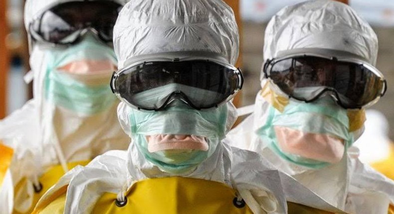 Illustrative photo of health professionals on disease containment (AFP)