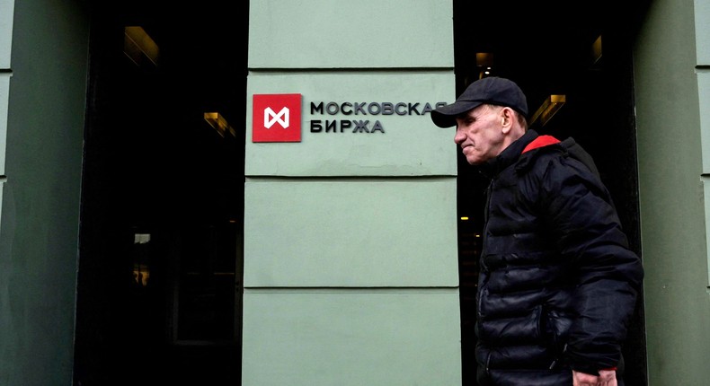 A man walks past the Moscow's stock market building in downtown Moscow on February 28.