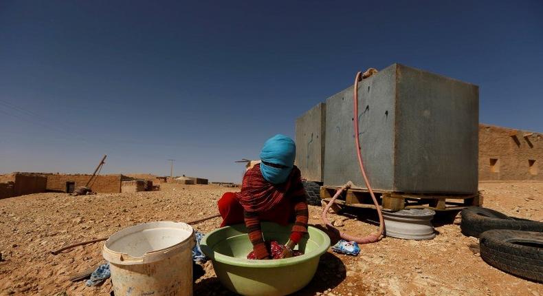 An indigenous Sahrawi woman washes her laundry in a refugee camp of Boudjdour in Tindouf, southern Algeria March 3, 2016. REUTERS/Zohra Bensemra