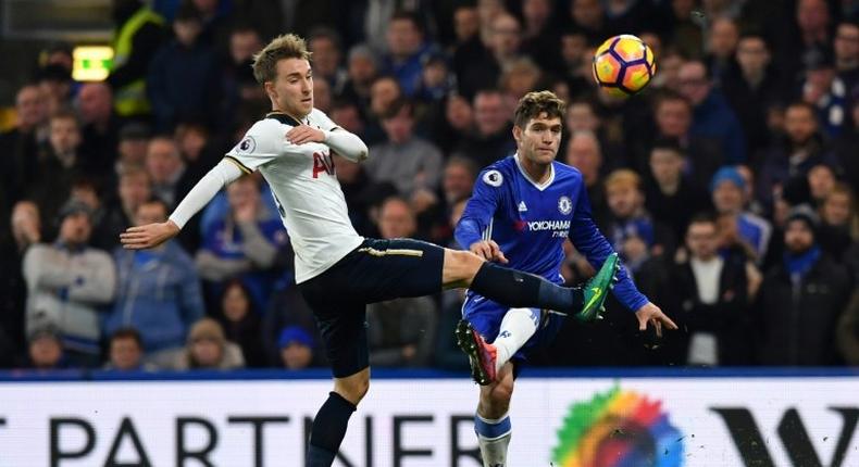 Tottenham Hotspur's midfielder Christian Eriksen (L) vies with Chelsea's defender Marcos Alonso (R) during the English Premier League football match November 26, 2016