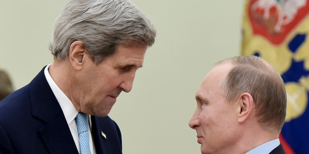 US Secretary of State John Kerry, left, speaks with Russia's President Vladimir Putin.