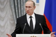 Russia's President Vladimir Putin speaks during a news conference after a meeting with his French co