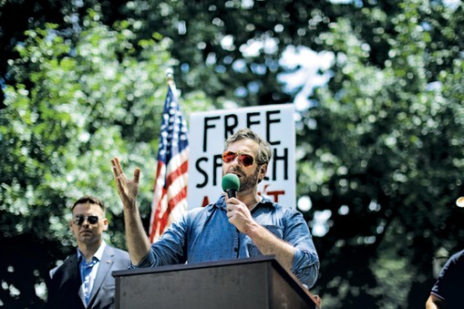 Mike Cernovich speaks during a rally about free speech outside of the White House in Washington