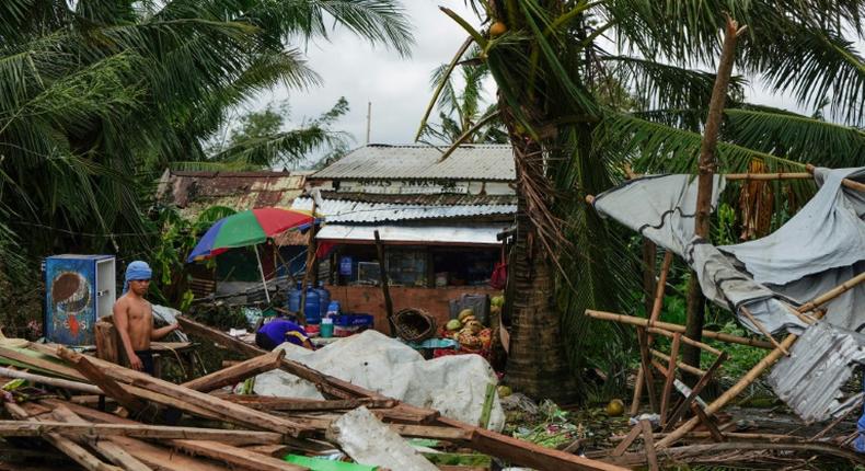 Typhoon Phanfone swept across the central Philippines on Christmas Day, tearing roofs off houses