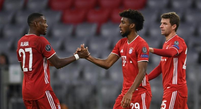 Kingsley Coman (C) celebrates scoring the opening goal in Bayern Munich's 2-0 win over Atletico Madrid