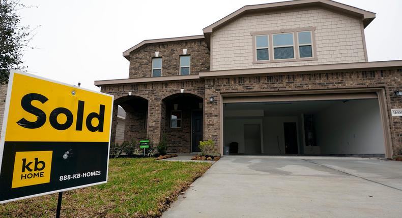 In this March 15, 2021 file photo, a sold sign stands in front of new home under construction in Houston. Mortgage rates remained near historic lows this week, Thursday, June 10.AP Photo/David J. Phillip, File