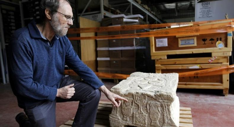 Professor Gideon Avni of the Israel Antiquities Authority displays the original Magdala Stone which was discovered in a Galilean synagogue dating to the Second Temple period (50 BC-100 AD)