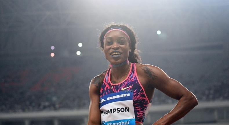 Jamaica's Elaine Thompson celebrates after winning the women’s 100 meters during the Shanghai Diamond League athletics competition in Shanghai on May 13, 2017