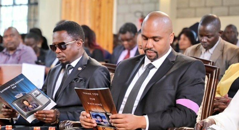 Martin Kasavuli with Sports CS Ababu Namwamba during the funeral service for his mother, the late Catherine Kasavuli