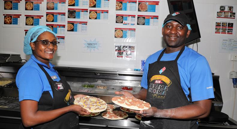 Chefs Eva Githua and Simon Oyugi prepare a pizza