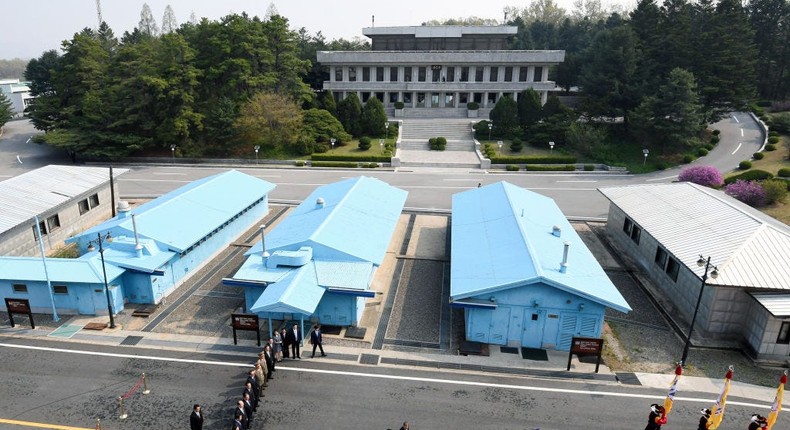 North Korea's leader Kim Jong Un walks with ccJae-in to the official summit Peace House building for a meeting in the Demilitarized Zone.KOREA SUMMIT PRESS POOL/AFP via Getty Images