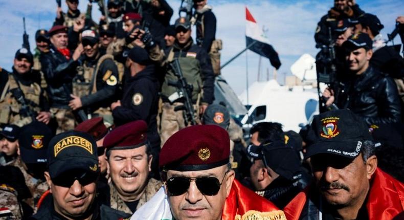 Iraqi Staff General Talib al-Sheghati (C) speaks during a press conference in the town of Bartalla, east of Mosul, on January 18, 2017