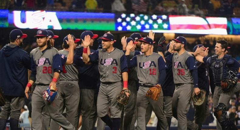 Team USA celebrate their 2-1 win over Japan at the end of the ninth inning in Game 2 of the Championship Round of the 2017 World Baseball Classic, at Dodger Stadium in Los Angeles, on March 21