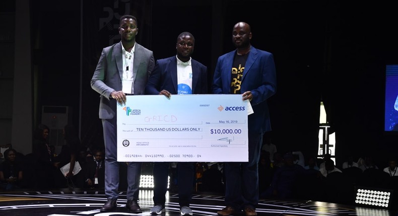 L-R: Uche Okafor; Regional Manager, West Africa, Bolt, Oghenetega Lortim; Start-up winner and Founder of Gricd and Segun Adeniyi; Head Africa Fintech Foundry presenting the dummy cheque to Start-up winner