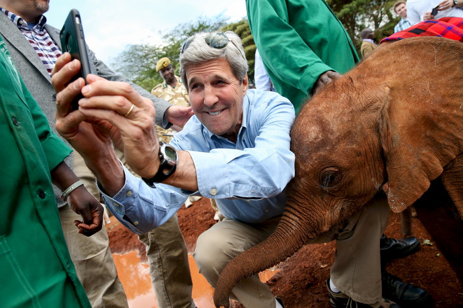 KENYA: Kerry takes a selfie with a baby elephant while touring the Sheldrick Center Elephant Orphanage at the Nairobi National Park on May 3, 2015.
