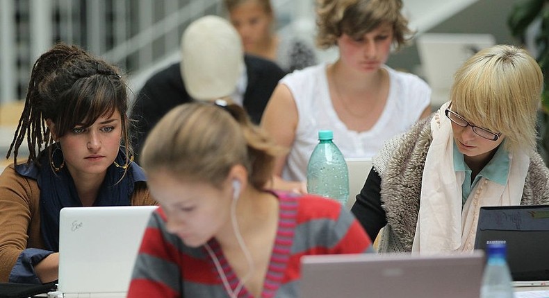 Students work laptops library university computer internet