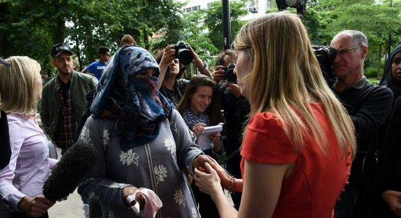 Camden council head Georgia Gould (R) talks to local residents about re-housing concerns. Thousands have been evacuated from 650 London flats due to safety fears following the Grenfell Tower fire, edy, but dozens refused to leave their homes