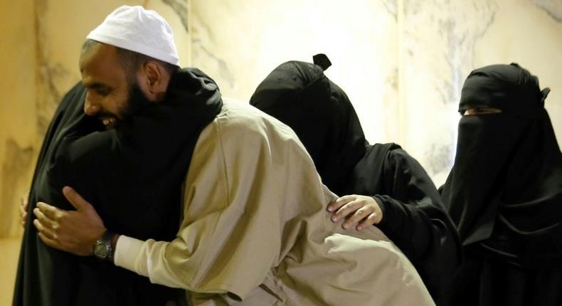 A former Yemeni inmate, released from the US military prison in Guantanamo Bay, is welcomed by his family upon his arrival in Riyadh on January 5, 2017