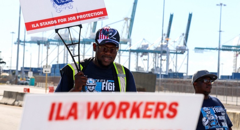 Dockworkers picket near the Port of Miami entrance and demand a new labor contract.Giorgio Viera / AFP via Getty Images