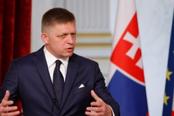 Slovakian Prime Minister Robert Fico gestures as he attends a joint news conference with the French President at the Elysee Palace in Paris