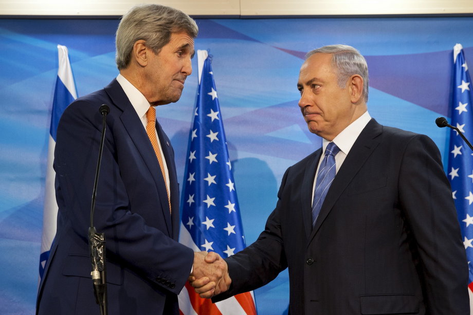 ISRAEL: Kerry shakes hands with Israeli Prime Minister Benjamin Netanyahu before their meeting at the Prime Minister's Office in Jerusalem, November 24, 2015.