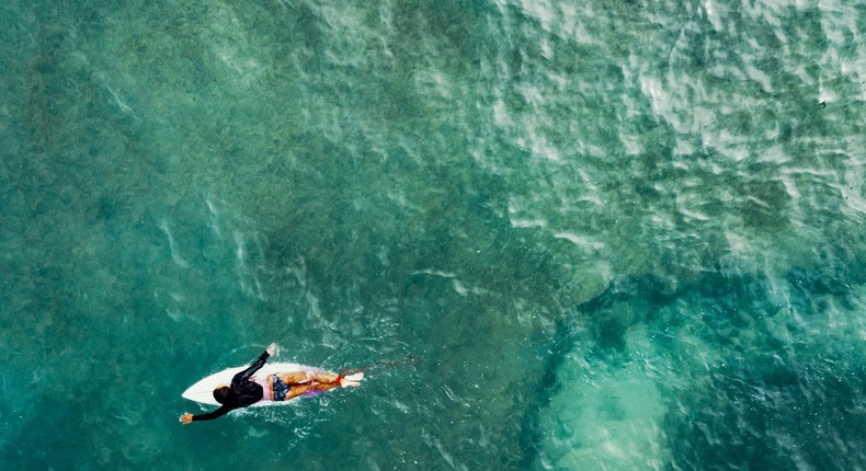 woman surfing ocean