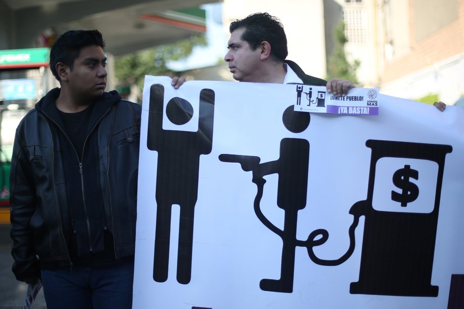 Protesters block the entrance to a gas station as they take part in a demonstration at Tlalpan avenue against the rising prices of gasoline enforced by the Mexican government, in Mexico City, January 3, 2017.