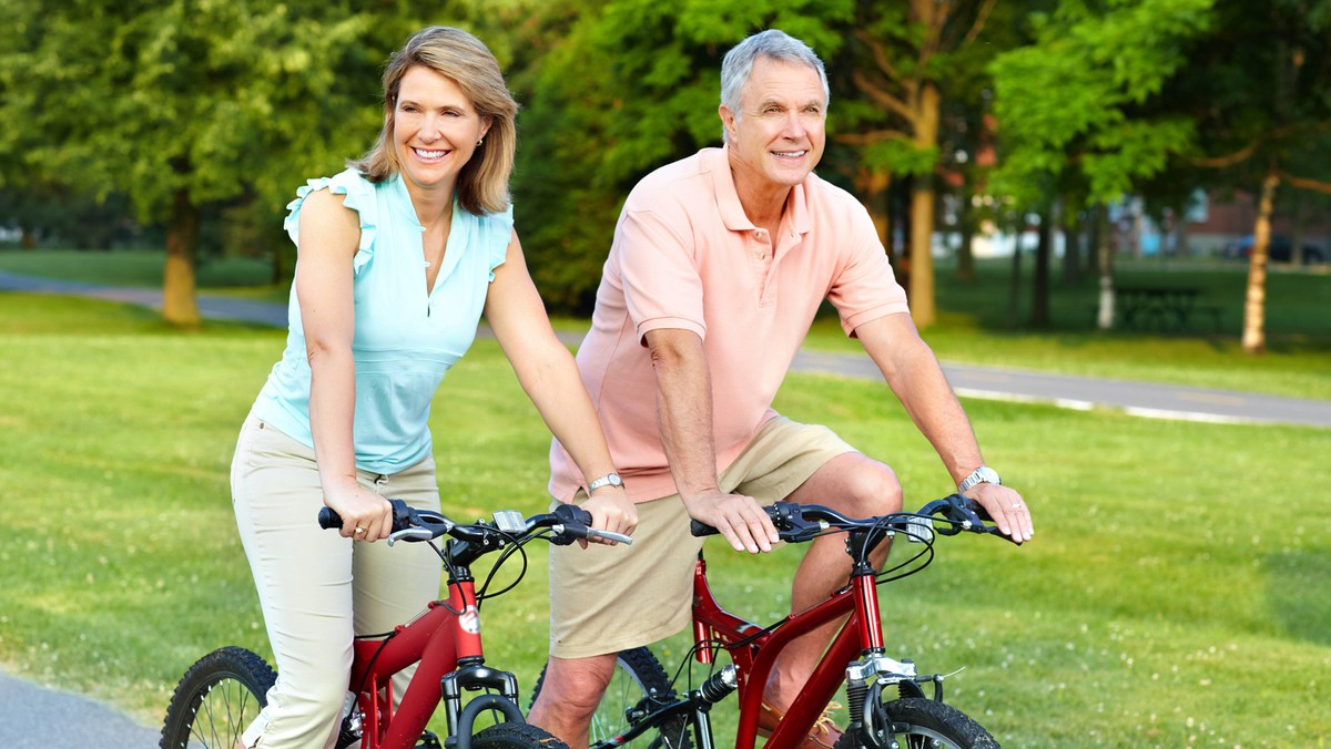 senior couple cycling