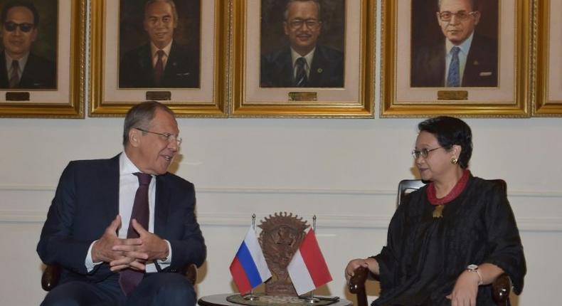 Russian Foreign Minister Sergei Lavrov talks with his Indonesian counterpart Retno Marsudi