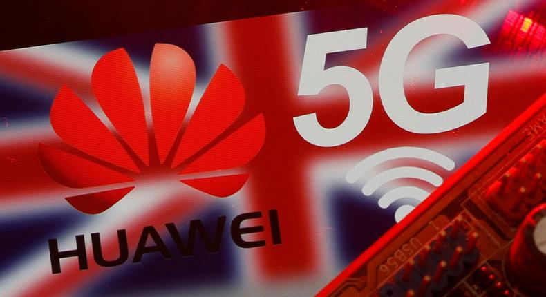 FILE PHOTO: The British flag and a smartphone with a Huawei and 5G network logo are seen on a PC motherboard in this illustration picture taken January 29, 2020. REUTERS/Dado Ruvic/Illustration