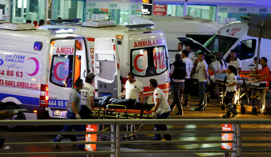 Paramedics push a stretcher at Turkey's largest airport, Istanbul Ataturk, after a blast on June 28.