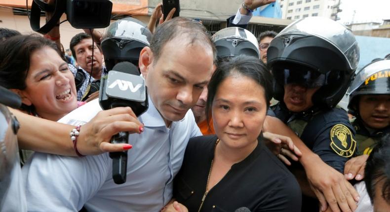 Keiko Fujimori arrives at a Lima courthouse with her husband Mark Villanella on Tuesday