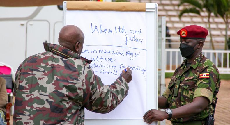 President Yoweri Museveni (left) outlines his vision 