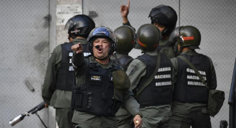 Soldiers from Venezuela's National Guard fired tear gas at protesters near the Cotiza command post taken over by rebel troops aiming to overthrow President Nicolas Maduro on January 21, 2019