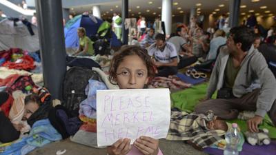 uchodźcy merkel imigranci