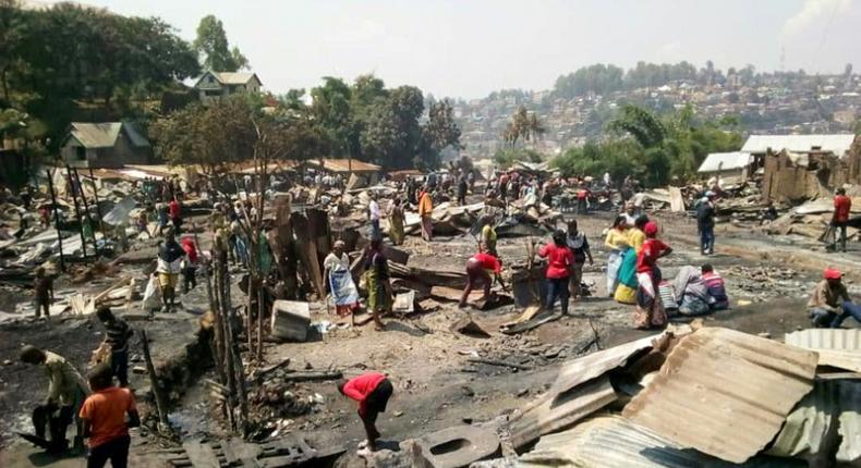 A massive fire sparked in a house where a woman fried donuts near cans of petrol, razed more than 150 homes in the eastern DR Congo, killing a seven-year-old girl.