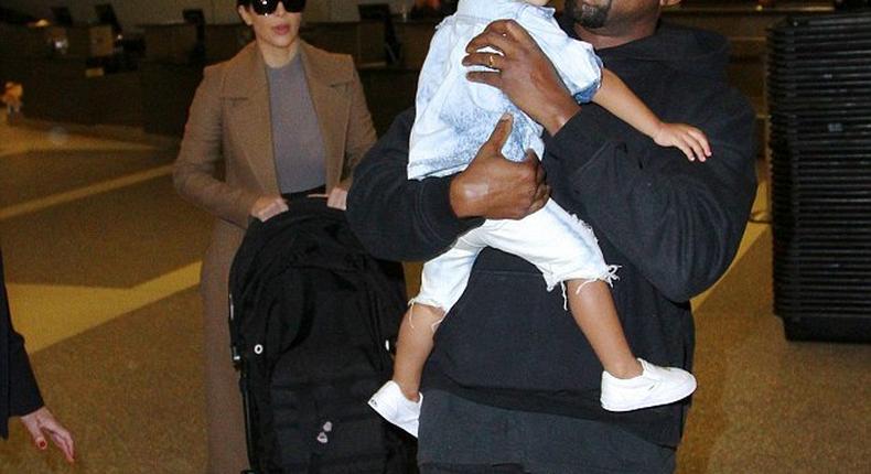 Kanye West arrives LAX with Kim Kardashian and North West