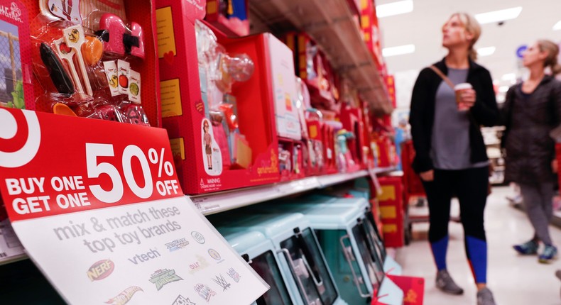 FILE- In this Nov. 23, 2018, file photo shoppers browse the aisles during a Black Friday sale at a Target store in Newport, Ky.AP Photo/John Minchillo