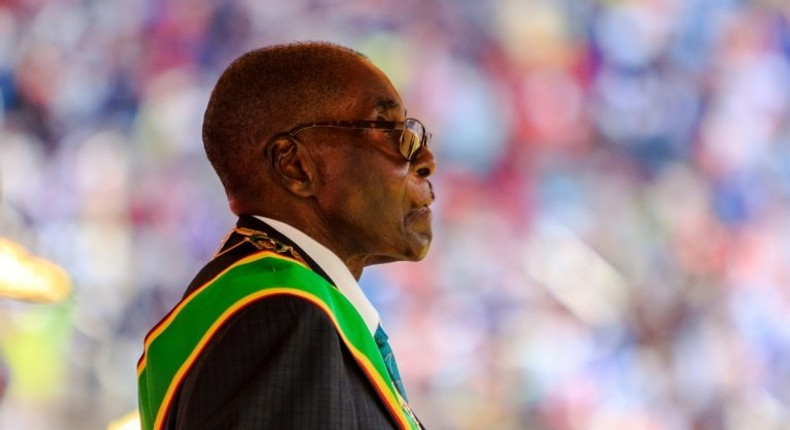 Zimbabwe's President Robert Mugabe reviews the guard of honour during the country's 37th Independence Day celebrations at the National Sports Stadium in Harare April 18, 2017